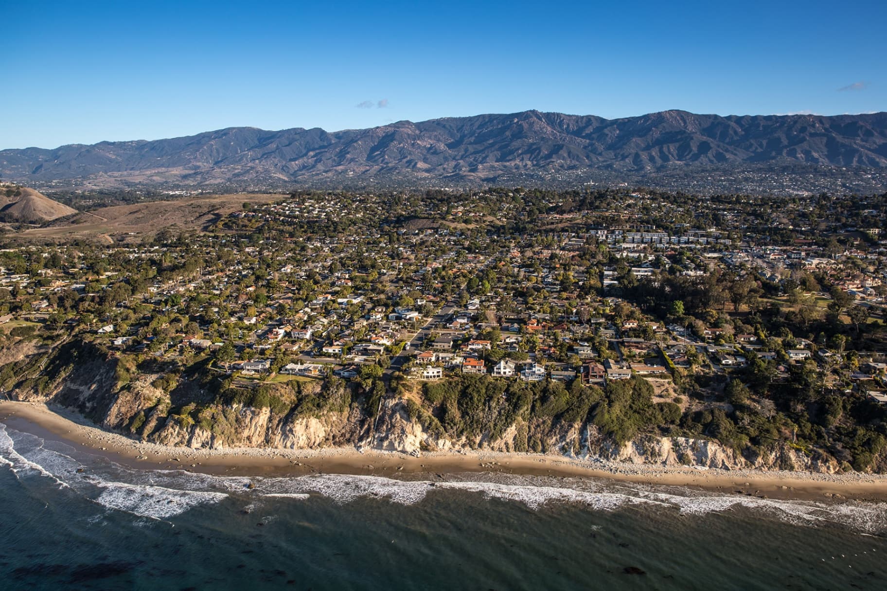 Isla Vista beach at sunset with palm trees